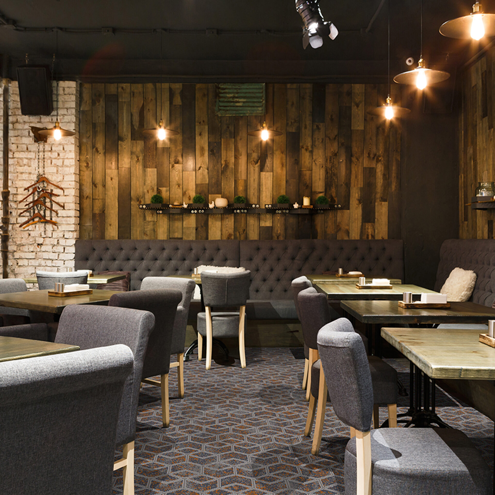 Cozy wooden interior of restaurant, copy space. Comfortable modern dining place, contemporary design background